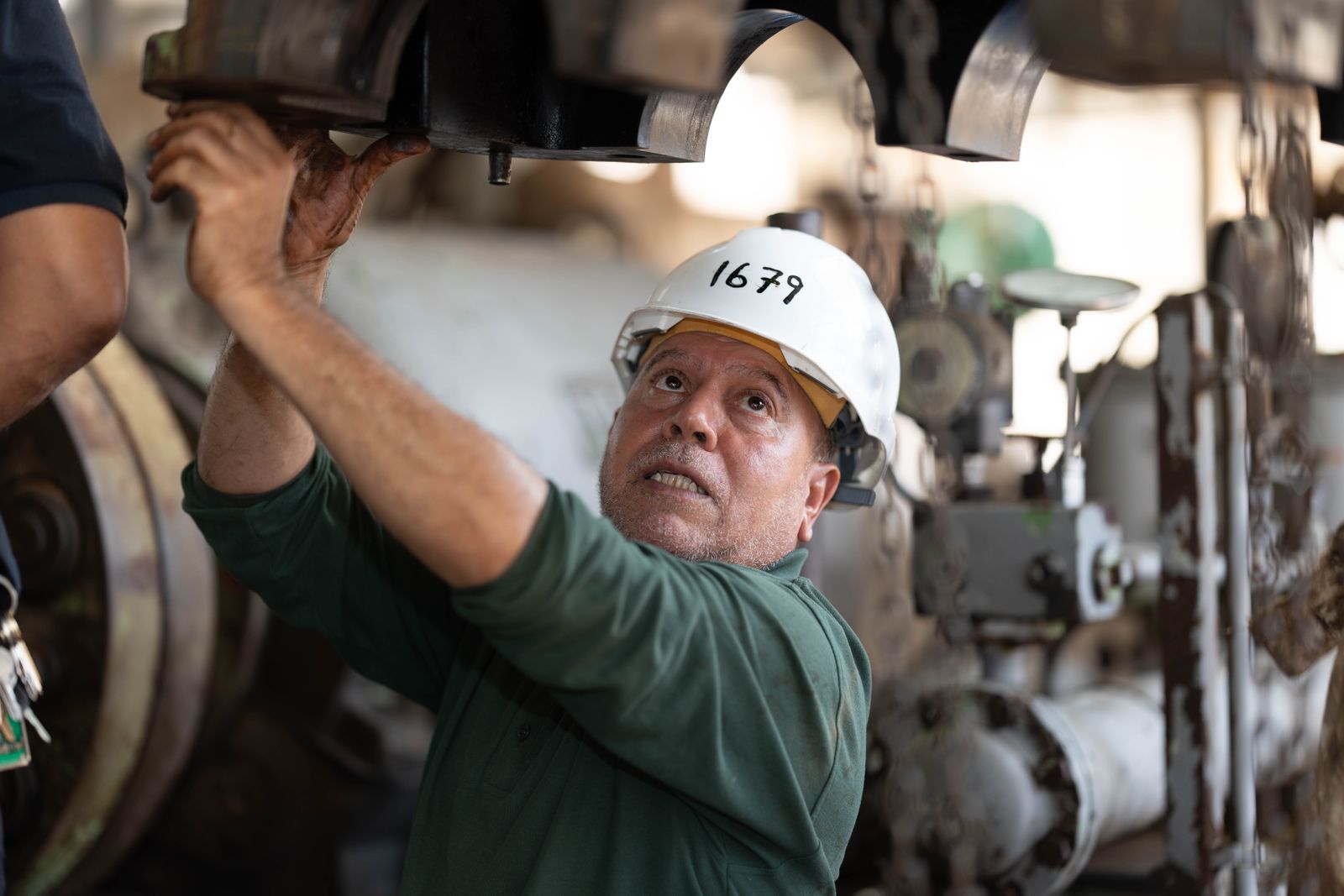 Maintenance technician servicing plant equipment